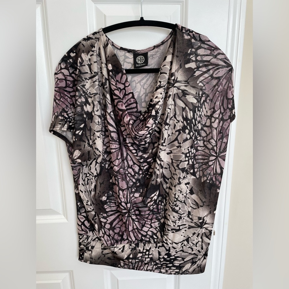 Dress up or with jeans. Relaxed fit, cowl neck
